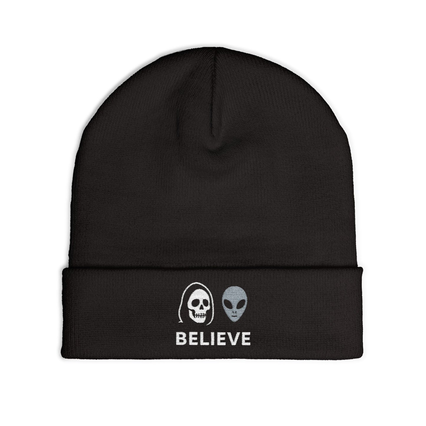 Black beanie with alien and skull design and 'BELIEVE' text on a white background