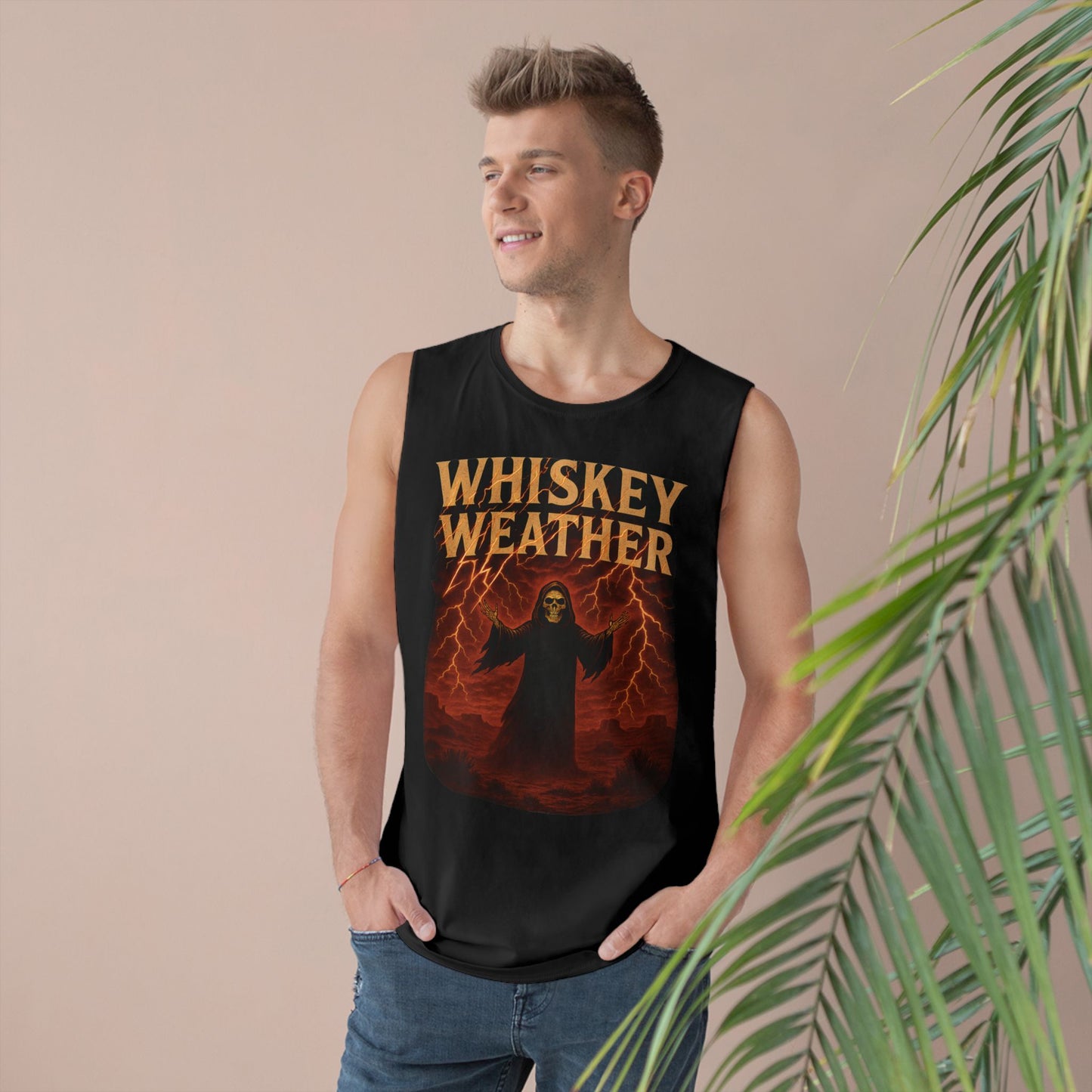 Man wearing a black sleeveless shirt with 'Whiskey Weather' design, standing against a beige wall with a plant.
