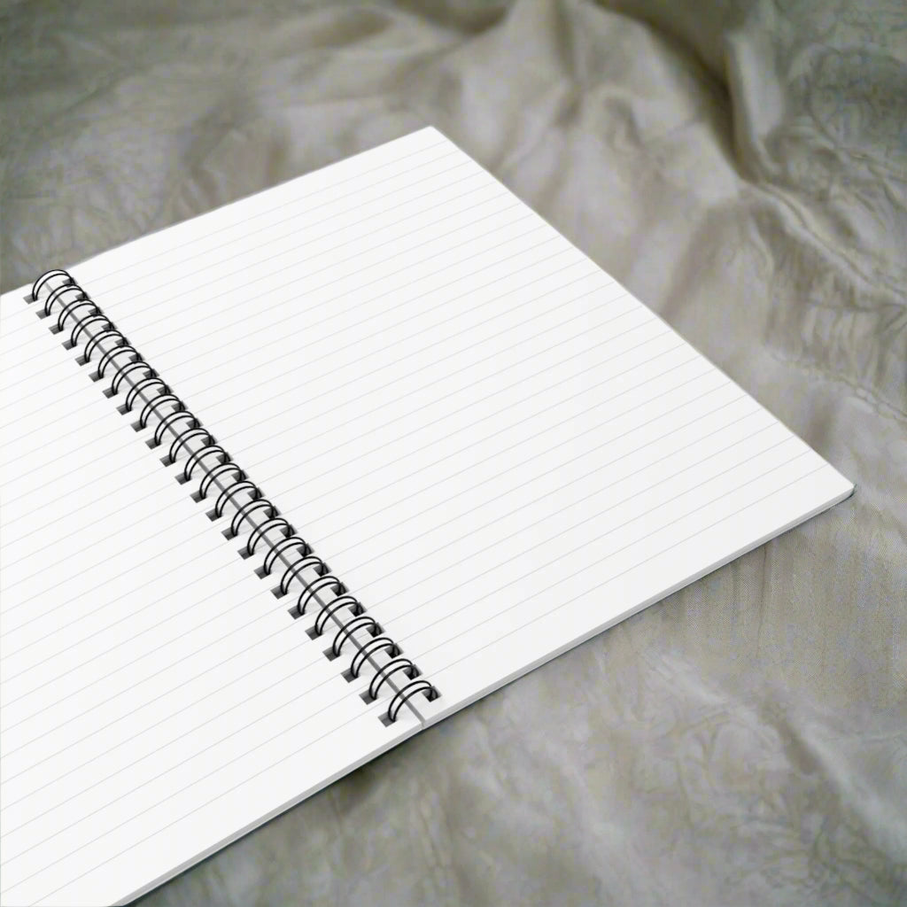 Open spiral-bound notebook on a white background