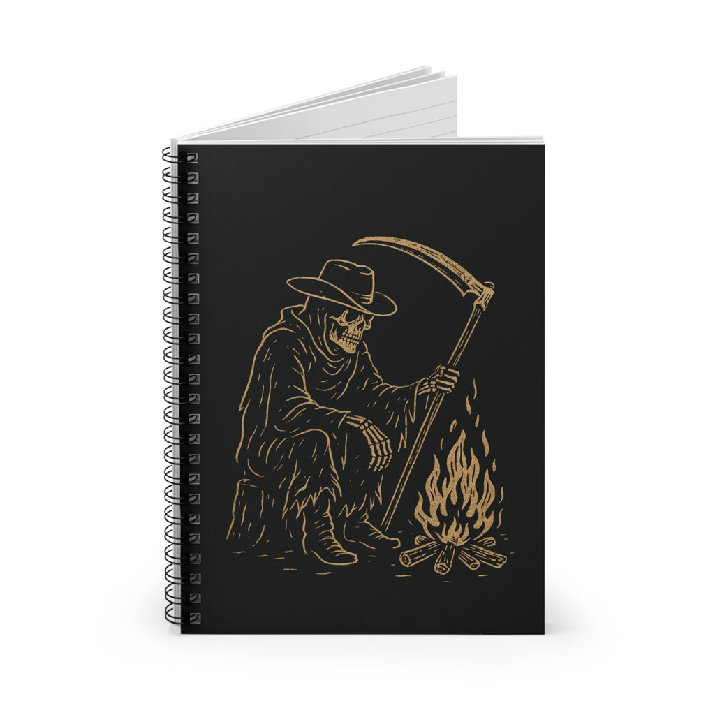 Notebook with a design of a skeleton holding a scythe by a campfire on a black cover.