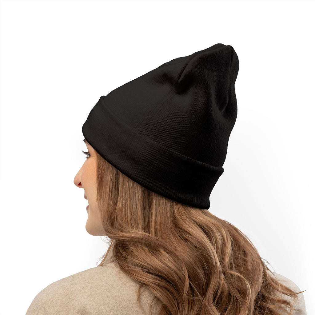 Person wearing a black beanie on a white background